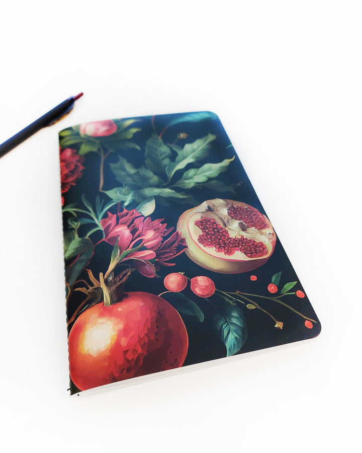 Pomegranate Lined notes journal with saddle stitching and a vibrant floral and fruit pattern by Jane's Agenda.