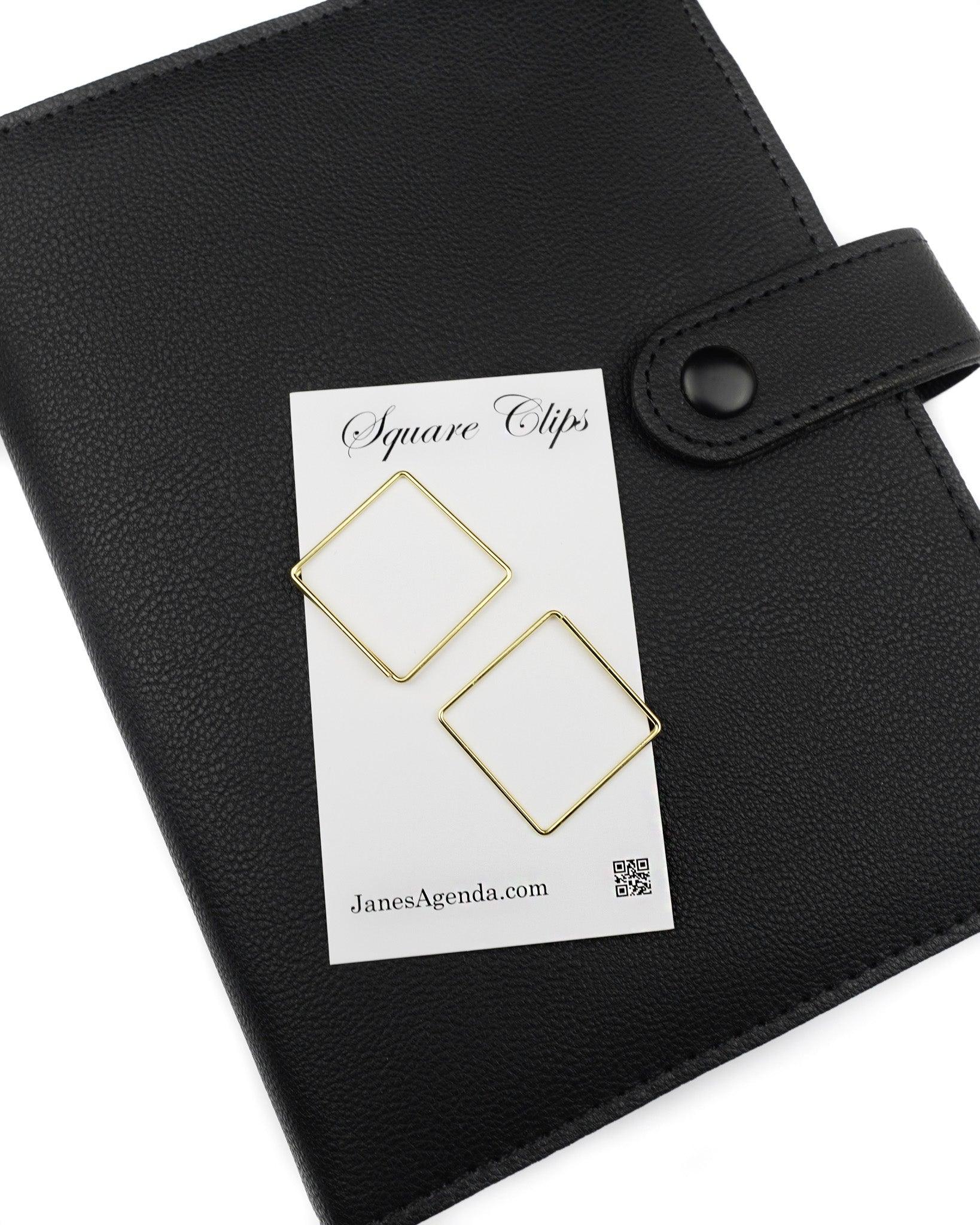 Square paper clips in a gold color for discbound and six ring planner by Jane's Agenda.