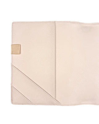Interior view of a light beige planner cover displayed open against a white background. The left side features two angled card pockets, a full-length slip pocket, and a coordinating elastic pen loop, while the right side includes a large document pocket. The textured material and neutral color create a clean, elegant look designed for stylish organization.