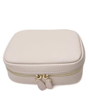 Mini train case in barely pink