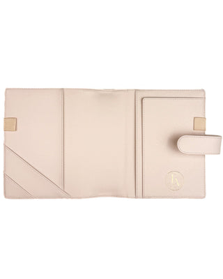 Interior view of a light beige planner cover displayed open against a white background. The cover features two angled card pockets, a full-length slip pocket, a coordinating elastic pen loop, a secure snap closure, and a gold foil Jane’s Agenda logo, combining elegant organization with a soft, timeless design.