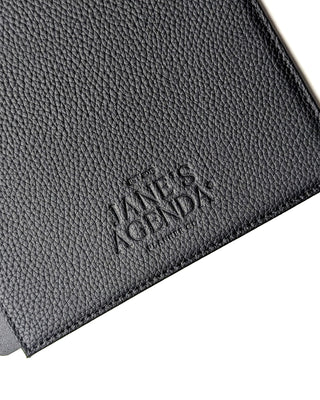 Embossed Jane’s Agenda logo on the interior back cover of the black vegan leather planner.