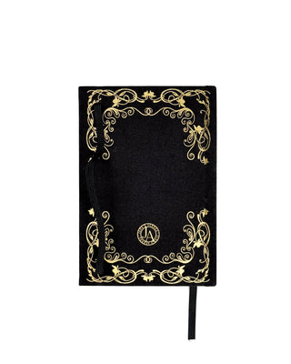 A Black and gold lined notebook.