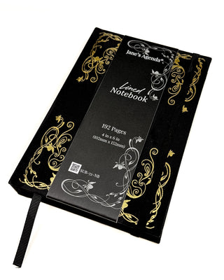 a black and gold lined journal with description.