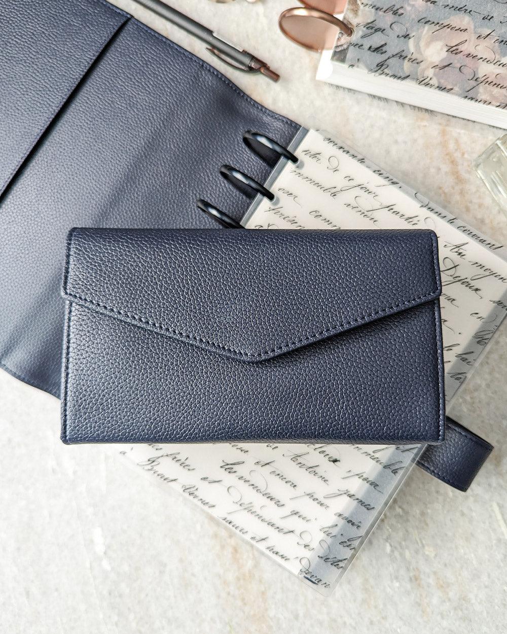 Sunglass case and wallet clutch in midnight blue vegn leather, with a pebble grain finish by Jane's Agenda.