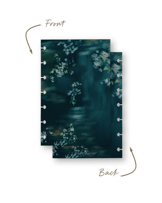 Front and back views of a removable discbound planner dashboard featuring a moody watercolor floral design with delicate white blossoms on a rich deep teal background. Both sides display coordinating botanical artwork for an elegant, dramatic look.