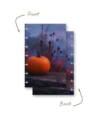 Front and back views of a discbound planner dashboard featuring an orange pumpkin on a rustic wooden surface surrounded by autumn foliage in moody purple, blue, and orange tones.