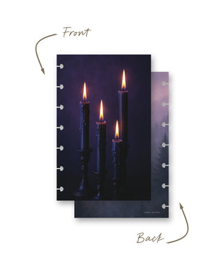 Front and back views of a Jane’s Agenda discbound planner dashboard featuring four glowing candles in dark holders against a moody deep purple background, paired with a misty evergreen forest scene on the reverse.