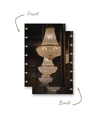 Front and back views of a Jane’s Agenda discbound planner dashboard featuring glowing crystal chandeliers reflected in mirrors against a dramatic dark interior.