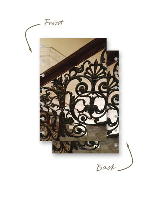 Front and back views of a Jane’s Agenda discbound planner dashboard featuring an ornate wrought-iron staircase railing with intricate scrollwork and floral details against a warm marble interior.