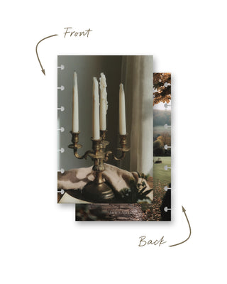 Front and back views of a Jane’s Agenda discbound planner dashboard featuring an antique brass candelabra with tall white candles in a cozy neutral setting, paired with an autumn country estate and garden scene on the reverse.