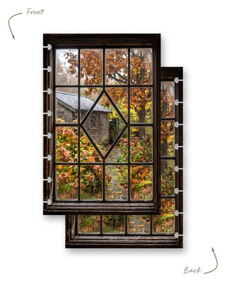 Jane’s Agenda reversible autumn-themed discbound planner dashboard featuring a rustic wooden window overlooking a cozy garden shed, stone pathway, and colorful fall foliage in shades of orange, gold, and green. Both sides display the same charming autumn garden scene, with disc-punched edges for easy planner customization.