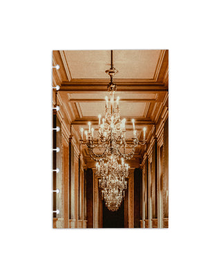 A discbound planner dashboard depicting a row of chandeliers hanging from a coffered ceiling in an elegant hallway