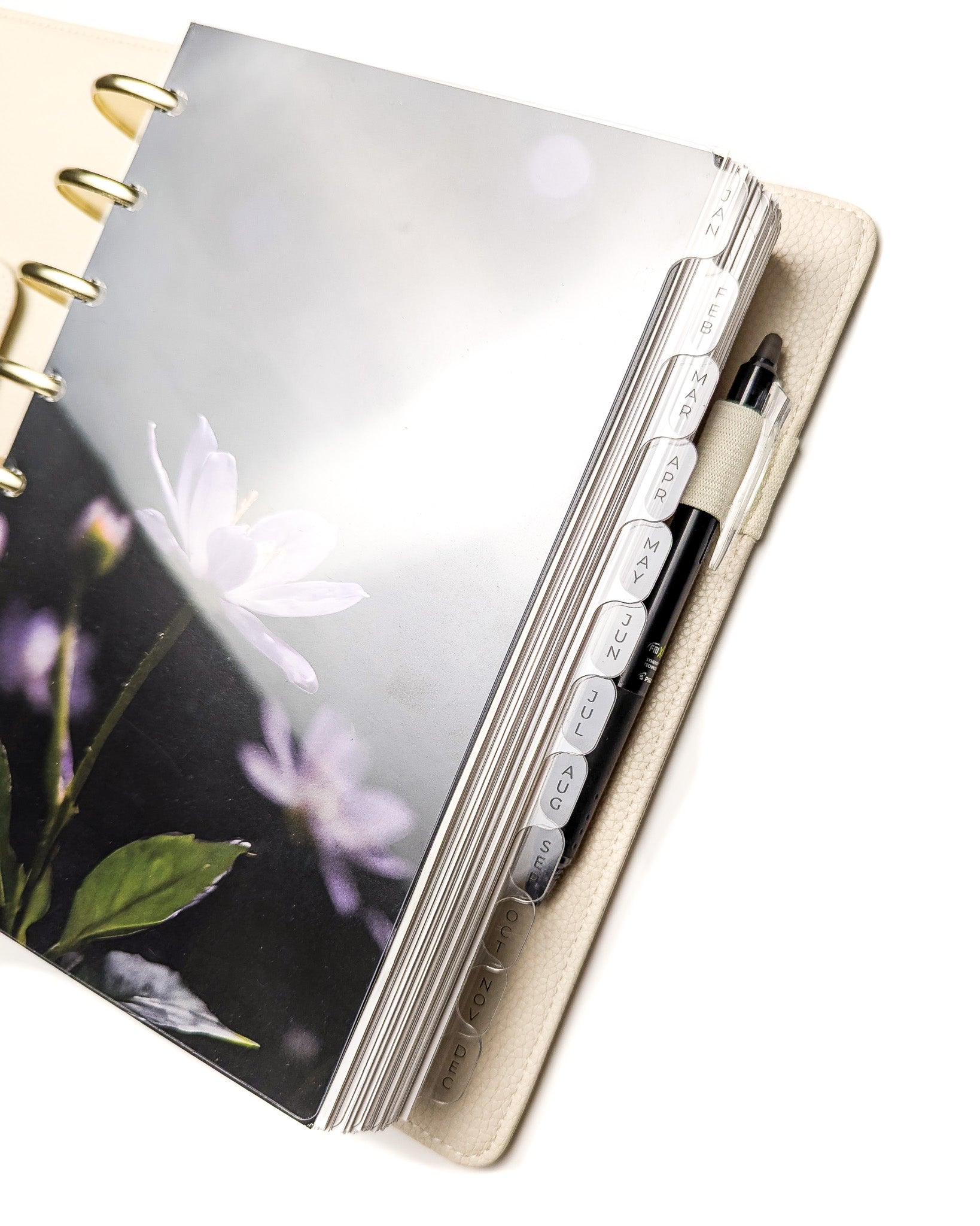 Clear monthly tabbed planner dividers for discbound planners, disc notebooks, and A5 planner sizes by Jane's Agenda.