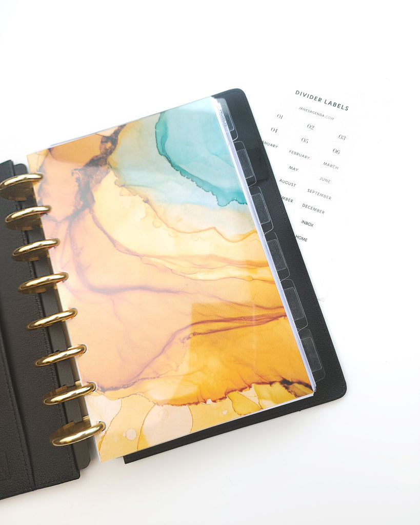 Clear glass plastic planner dividers for six ring planners and discbound planners. Planner and stationary accessories by Janes Agenda.
