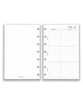 Two open discbound punched planner pages showing a daily schedule and dot grid layout on a white background.