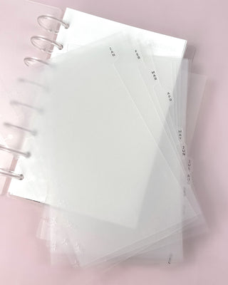 Clear frosted planner dividers on a discbound planning system