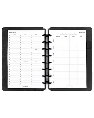 Black planner with two open pages showing a grocery list and meal plan on a white background