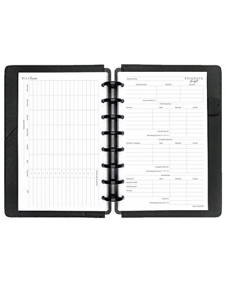 Open discbound planner with black cover and paycheck and bill tracker insert pages on a white background