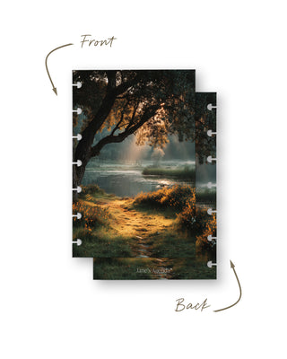 Front and back views of a discbound planner dashboard featuring a peaceful autumn pond, a sunlit grassy path, and warm golden foliage beneath a large tree.
