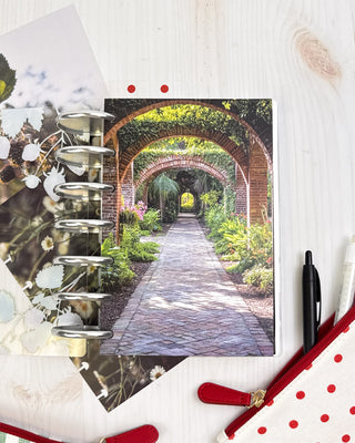 Jane's Agenda serene brick garden archway photography Planner Dashboard with Metal Binding Discs — nature-inspired Discbound Planning accessory for women