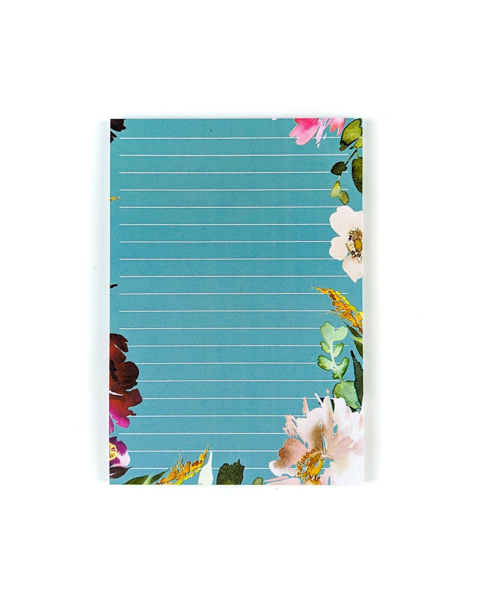 Sticky Note pad in a teal hue with floral around the edges by Jane's Agenda.