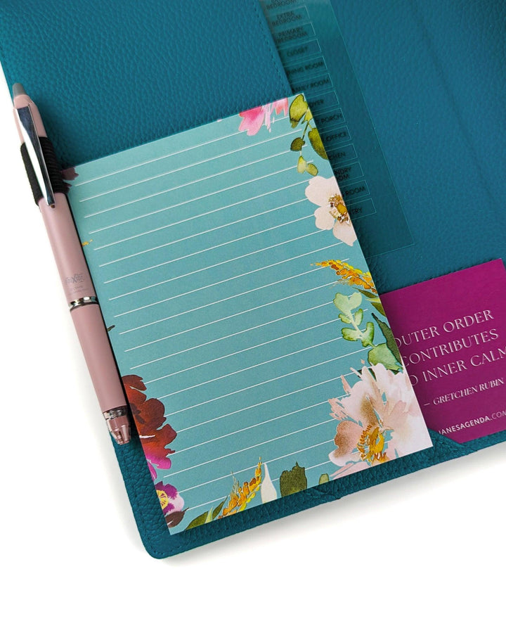 Sticky Note pad in a teal hue with floral around the edges by Jane's Agenda.