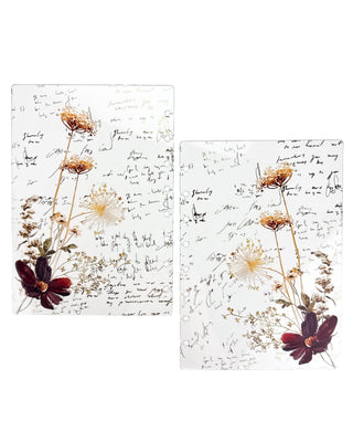 Front and back views of a clear Jane’s Agenda discbound planner dashboard featuring delicate pressed wildflowers in cream and gold tones, a deep burgundy bloom, and elegant handwritten script.