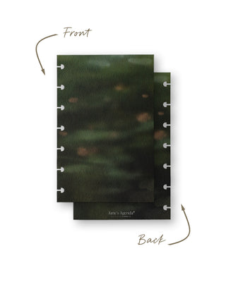 Front and back views of a pair of discbound planner covers featuring a dark, moody abstract landscape with soft-focus green and earthy brown tones. The coordinating back cover includes subtle Jane’s Agenda branding near the bottom.