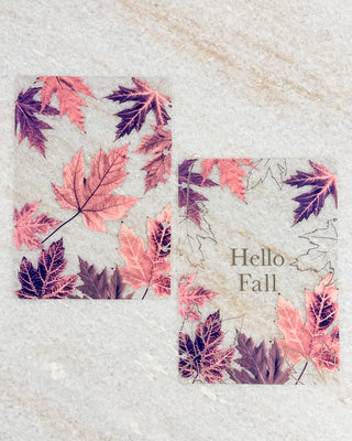 Clear discbound planner cover and matching dashboard featuring layered autumn maple leaves in pink, burgundy, and purple tones, with “Hello Fall” in gold lettering.