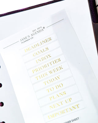 Sheet of clear gold foil planner labels  on a white background