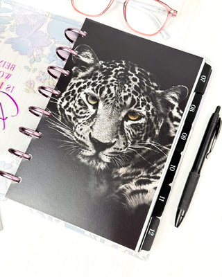 Jane's Agenda black and white leopard portrait Discbound Planner Dashboard with numbered monthly tabbed Planner dividers and Metal Binding Discs — bold dark aesthetic Discbound Planning system