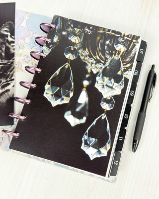 Jane's Agenda dark crystal chandelier Discbound Planner Dashboard with numbered monthly tabbed planner dividers and Metal Binding Discs — luxury dark aesthetic Discbound Planning system