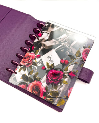 Victorian-inspired, vibrant color roses, clear planner cover, layered with the Romantic Locks planner dashboard. With Violet metal discs and the Purple Vegan Leather Wrap Cover. 