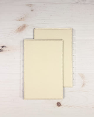 Discbound vegan leather snap on cover that is reversible, showing the front of the cover overlapping on a white background.