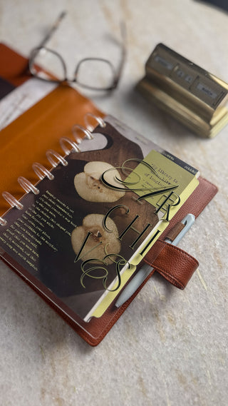 Jane's Agenda 'Archives' Discbound Planner Cover with embossed typography and moody pear dashboard with quote card on Metal Binding Discs
