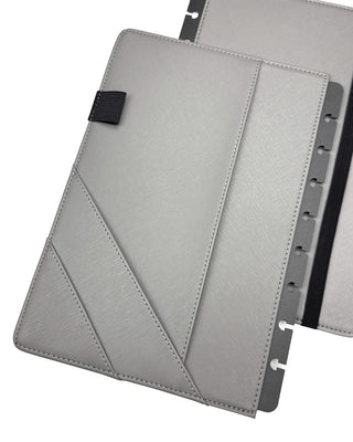 Gray planner cover with three inside pockets and one pen loop on a white background