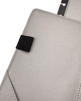 Features an elastic pen loop sewn into the inside cover.