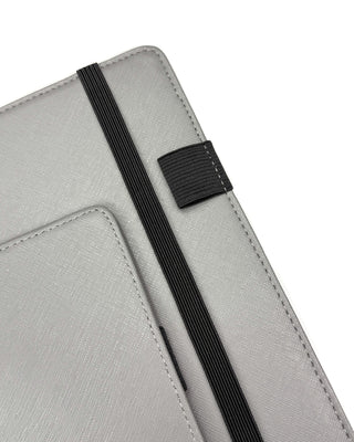 Close up of an elastic pen loop and an elastic planner ribbon.
