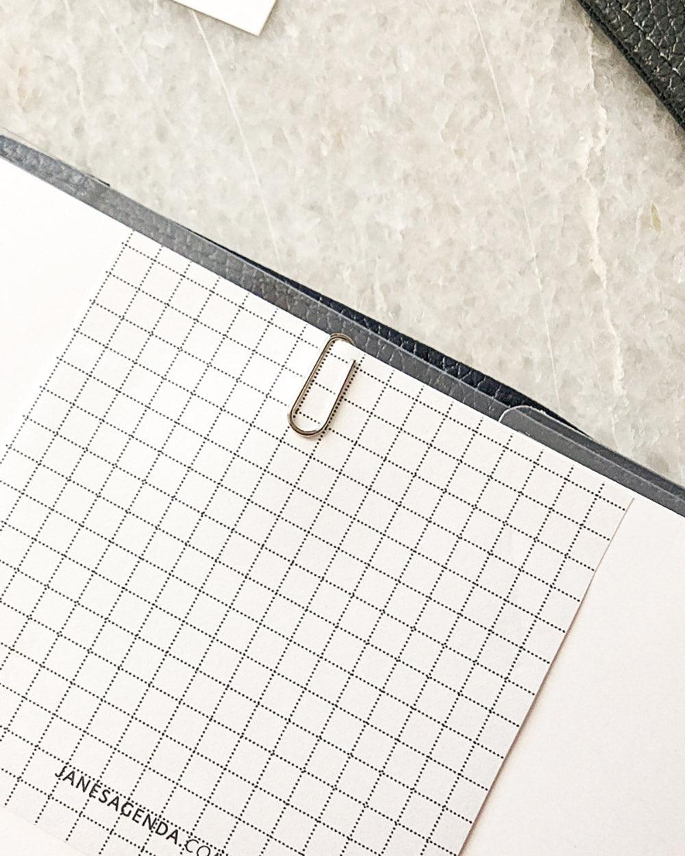 Silver metal mini paperclips for clipping notes and quote cards to your discbound planner, notebook, or binder by Jane's Agenda.