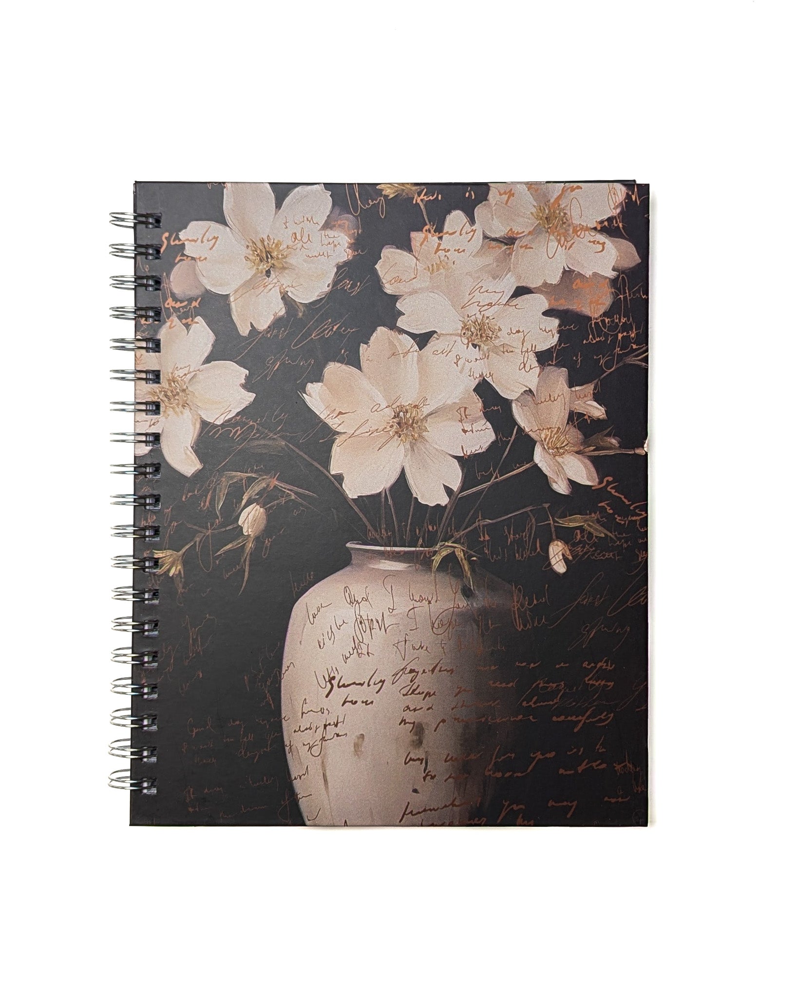 Detailed shot of the floral-themed notebook cover with cream-colored flowers and a textured vase design.