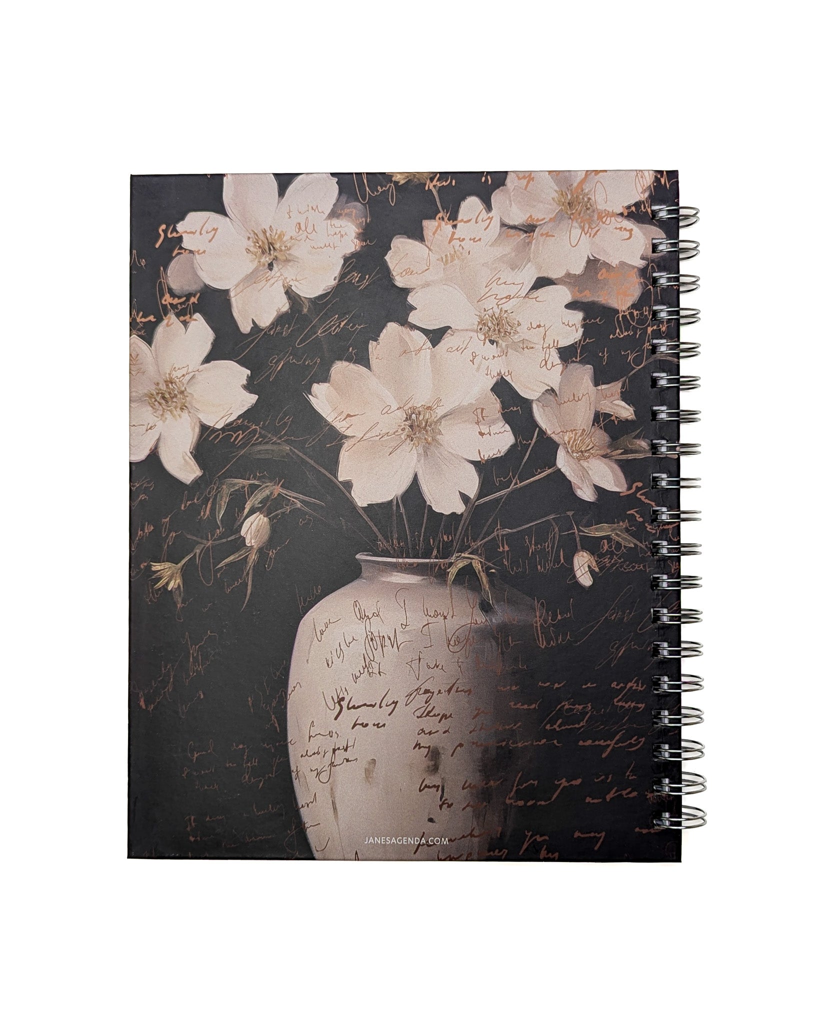 Detailed shot of the floral-themed notebook cover with cream-colored flowers and a textured vase design.