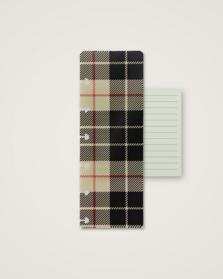 Discbound planner pagefinder featuring a classic plaid pattern in black, cream, and red, layered over a pale green lined planner page.