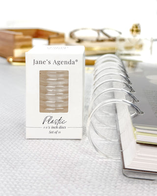 Jane's Agenda plastic discs packaging with discs on a textured surface