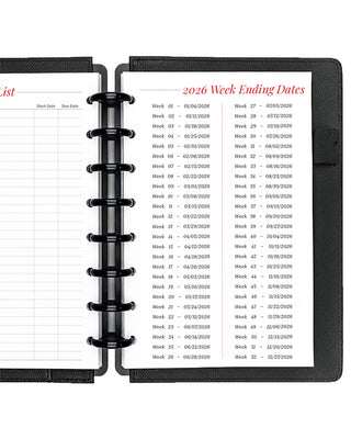 Project planner inserts inside a black discbound planner notebook over a white background.