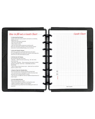 Project planner inserts inside a black discbound planner notebook over a white background.