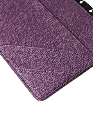 Close-up of angled pocket stitching inside the purple planner snap cover, highlighting textured vegan leather detail.