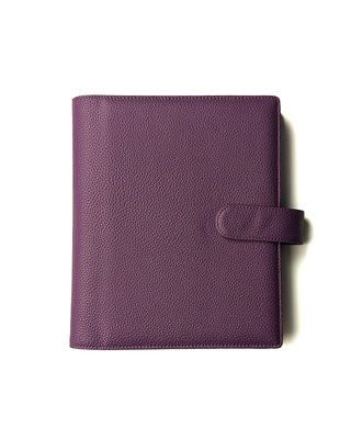 A closed purple leather planner wrap cover from Jane's Agenda with detailed texture and stitching.