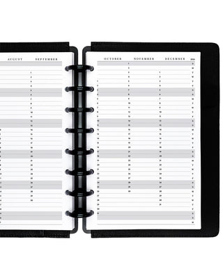 Open planner showing a two-page spread with calendar entries on a white background