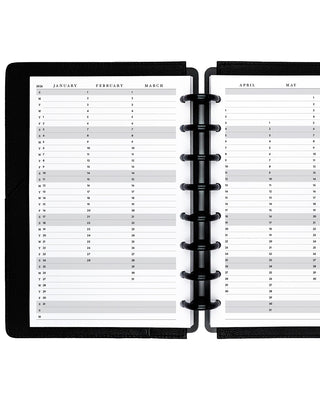 Open planner showing a monthly schedule with black binding